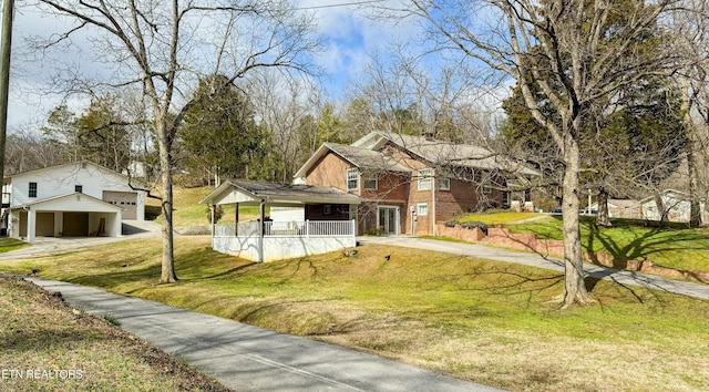 1017 Old Knoxville Hwy, Sevierville, TN 37862 - view of front of home with covered porch, a front yard, and a garage