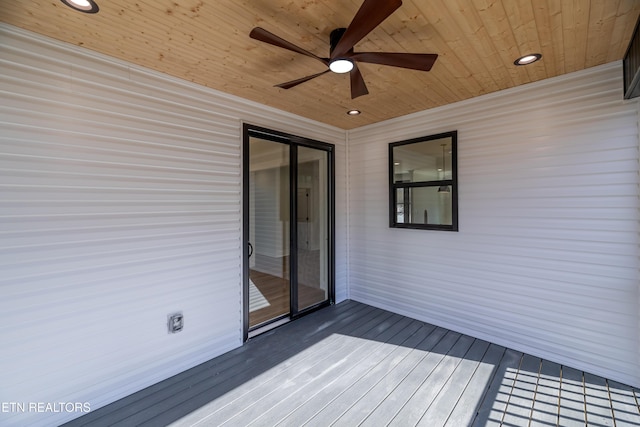 wooden terrace featuring ceiling fan