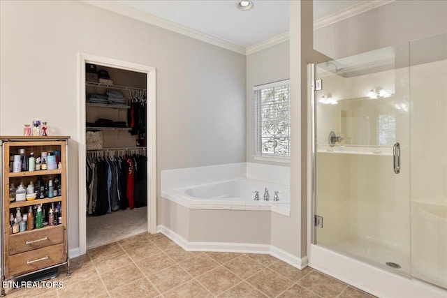 full bath with a stall shower, ornamental molding, tile patterned floors, a garden tub, and a walk in closet