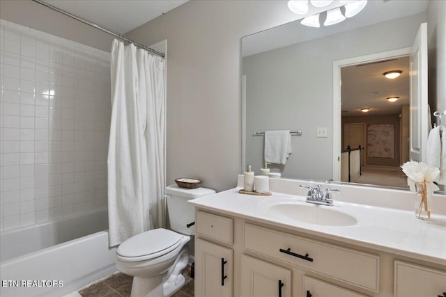 full bathroom with shower / tub combo, vanity, and toilet