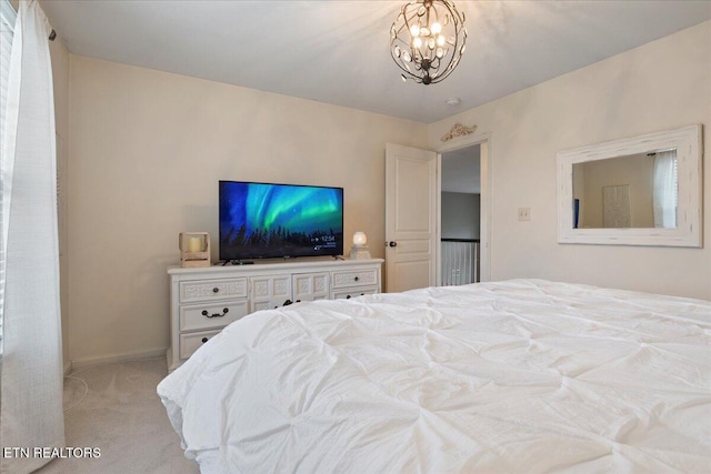 bedroom featuring baseboards, a chandelier, and light colored carpet