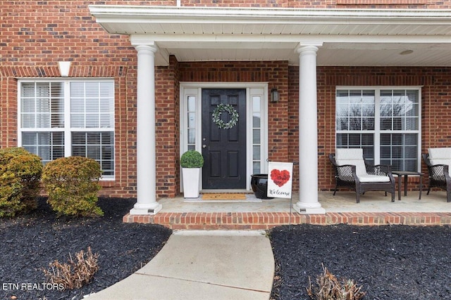 property entrance featuring covered porch