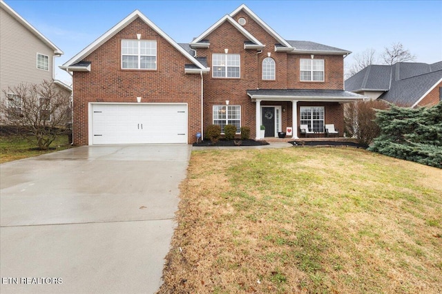 view of front of house featuring a front yard and a garage