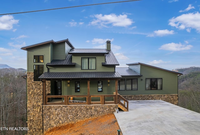 view of front of house featuring a mountain view and covered porch