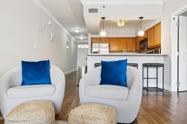 living room featuring crown molding and dark hardwood / wood-style floors