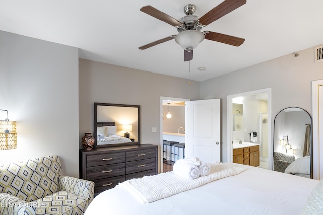 bedroom featuring sink and ensuite bath