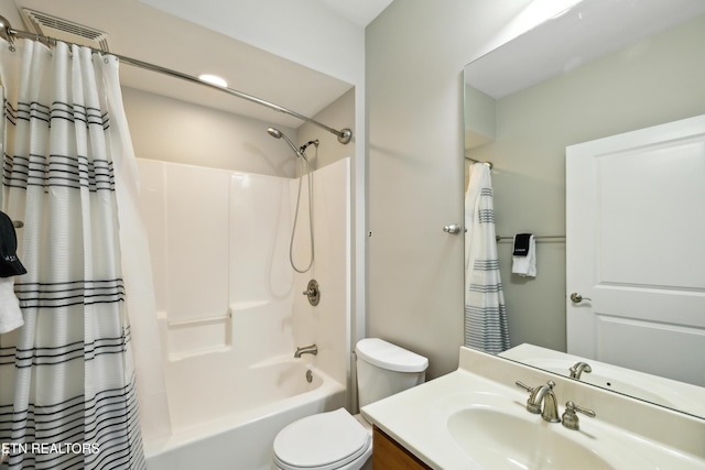 full bathroom featuring vanity, toilet, and shower / bath combo with shower curtain