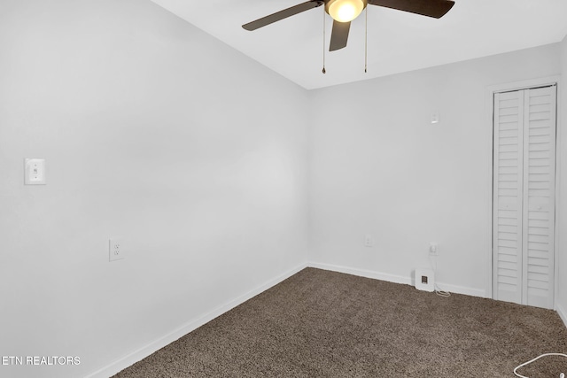 empty room featuring carpet floors and ceiling fan