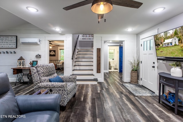 living area featuring dark wood-style flooring, recessed lighting, stairway, an AC wall unit, and ceiling fan