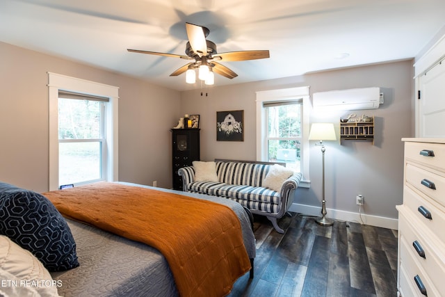 bedroom featuring dark wood-type flooring, an AC wall unit, ceiling fan, and baseboards