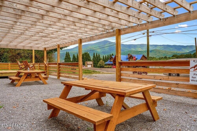 exterior space with a pergola and a mountain view