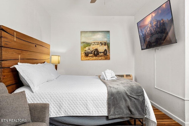 bedroom featuring ceiling fan and wood-type flooring