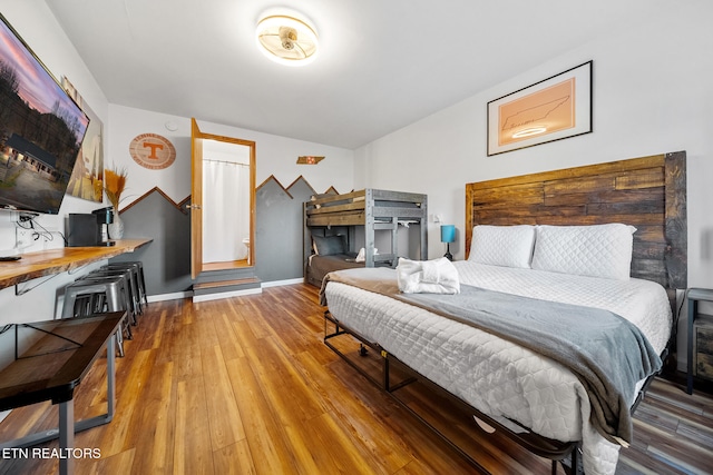 bedroom with hardwood / wood-style floors