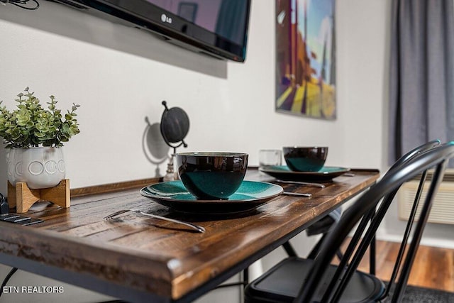 dining area with hardwood / wood-style flooring