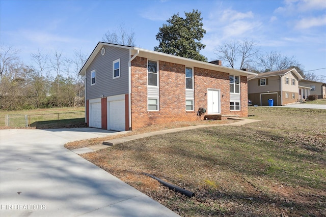 view of front facade with a front yard and a garage