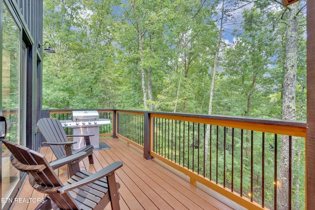 wooden terrace featuring grilling area