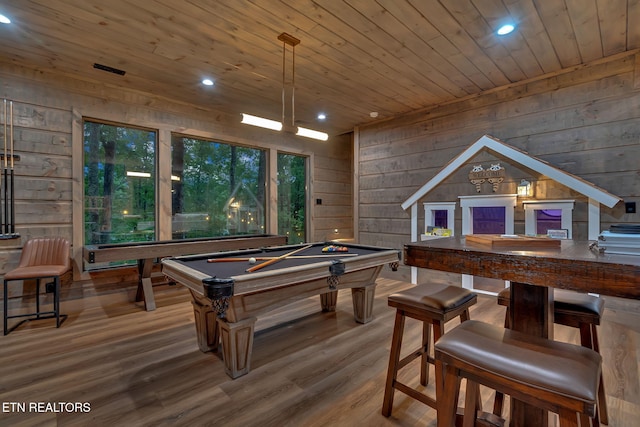 recreation room featuring wood walls, wood ceiling, wood finished floors, and recessed lighting