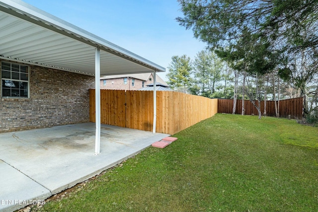 view of yard with a patio area and a fenced backyard