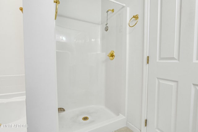 bathroom with a stall shower