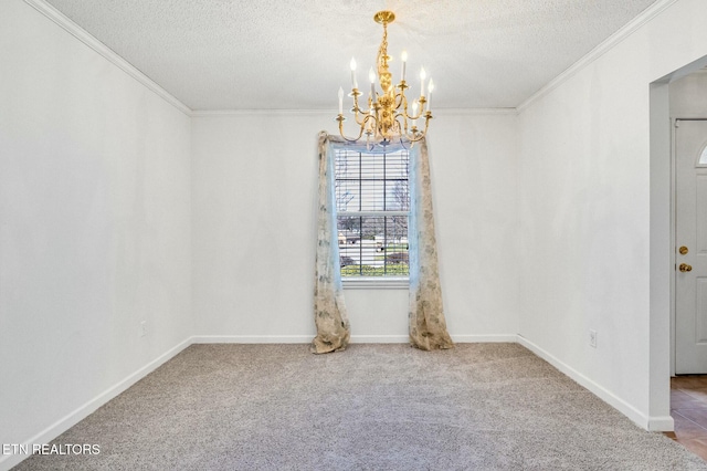 unfurnished dining area with an inviting chandelier, a textured ceiling, ornamental molding, and carpet flooring