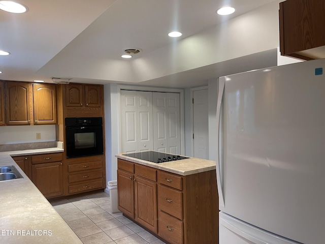 kitchen with light tile patterned floors, recessed lighting, black appliances, light countertops, and brown cabinets