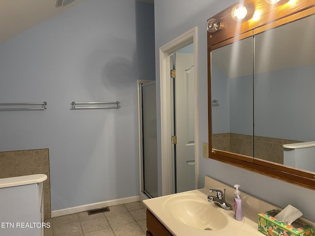 full bathroom with tile patterned floors, visible vents, a shower with shower door, baseboards, and vanity