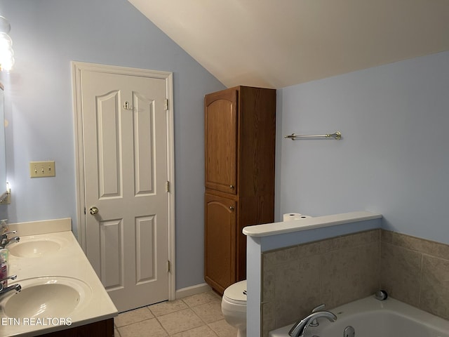 bathroom with a sink, lofted ceiling, a garden tub, and tile patterned flooring