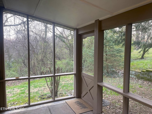 unfurnished sunroom featuring a healthy amount of sunlight