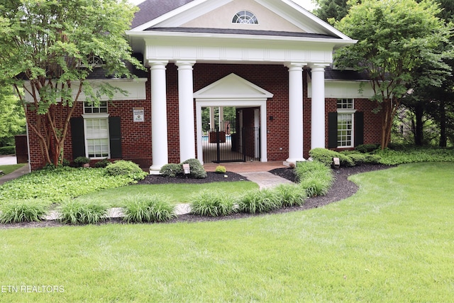 12309 Cotton Blossom Ln, Knoxville, TN 37934 - view of exterior entry with a lawn and brick siding