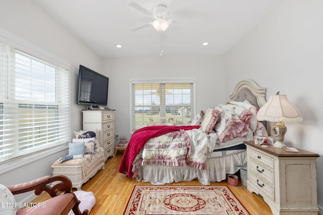 bedroom featuring light wood-type flooring and ceiling fan