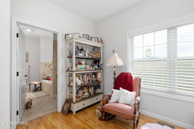 sitting room with light hardwood / wood-style flooring