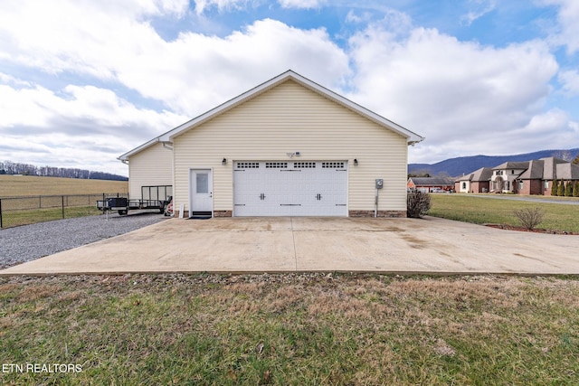 view of home's exterior with a yard and a garage