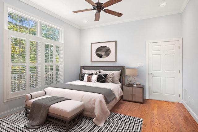 bedroom featuring baseboards, ornamental molding, recessed lighting, and light wood-style floors