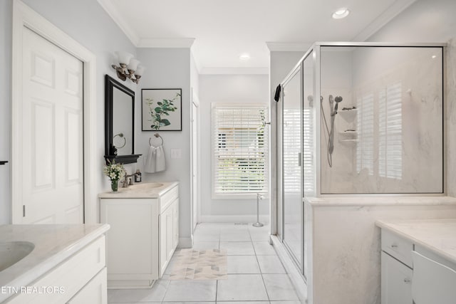 full bath with crown molding, recessed lighting, two vanities, a stall shower, and a sink