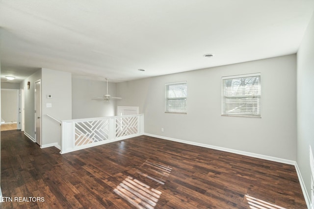 unfurnished room featuring dark hardwood / wood-style flooring