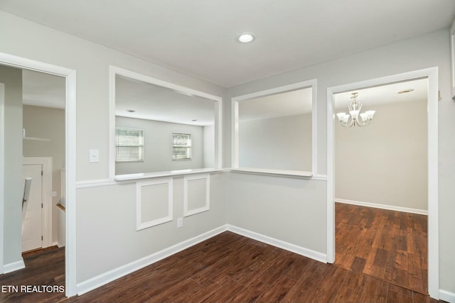 unfurnished room featuring dark wood-type flooring