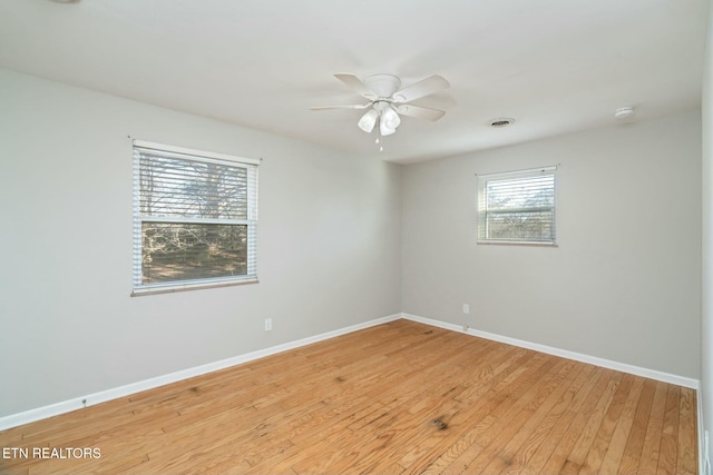 spare room featuring light hardwood / wood-style floors and ceiling fan