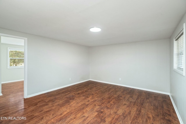 unfurnished room featuring dark hardwood / wood-style floors