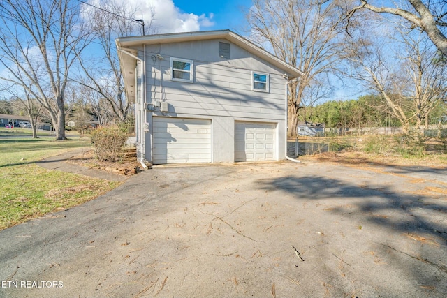 view of side of property featuring a garage