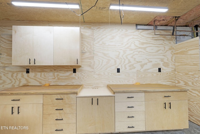 kitchen featuring light countertops and light brown cabinetry