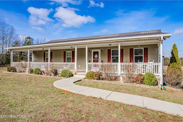 view of front of property with a front yard and a porch