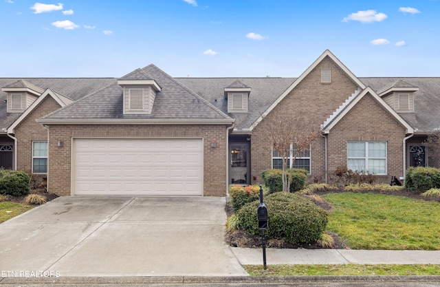 view of front of home with a front yard and a garage