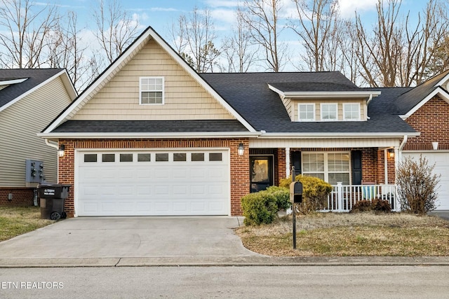 view of front of house with covered porch and a garage