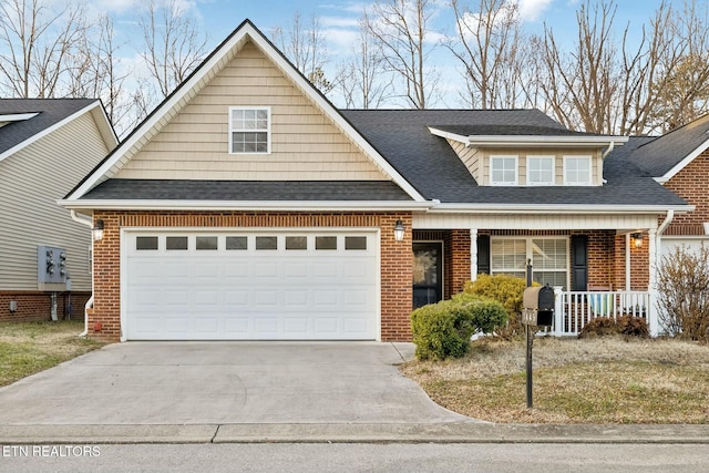 view of front of home with covered porch and a garage