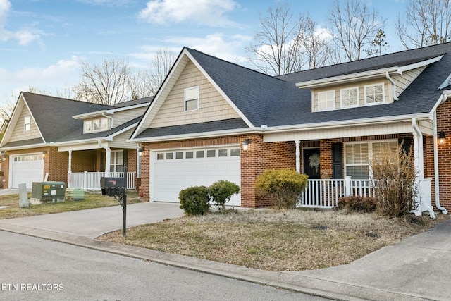 view of front of home featuring a garage and a porch