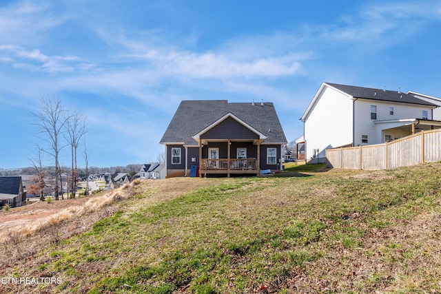 rear view of house with a yard