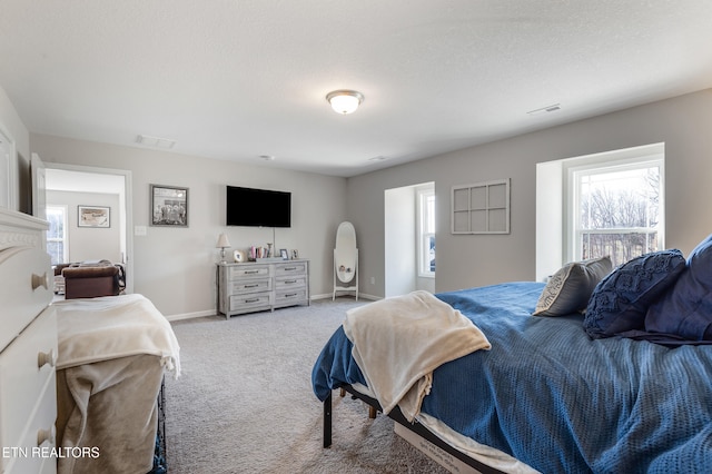 carpeted bedroom with a textured ceiling