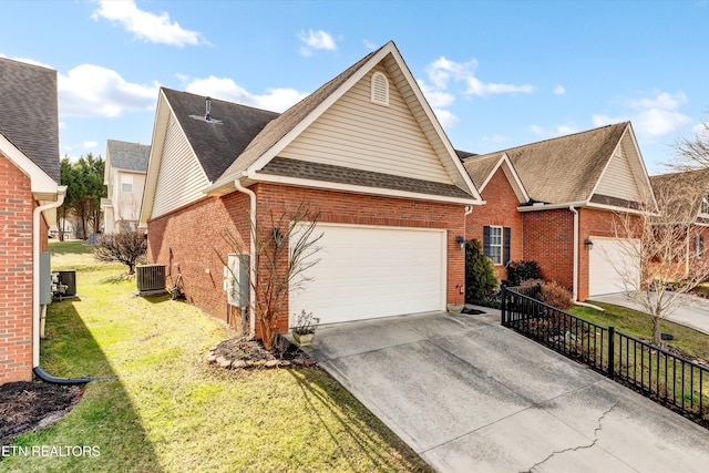 view of front of house featuring a garage, brick siding, a shingled roof, driveway, and a front yard