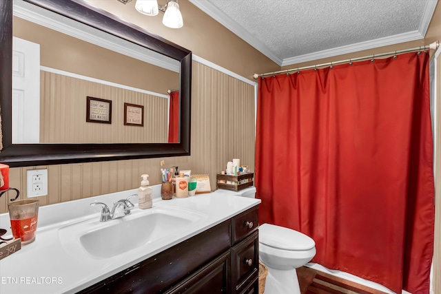 full bathroom with ornamental molding, toilet, a textured ceiling, and vanity