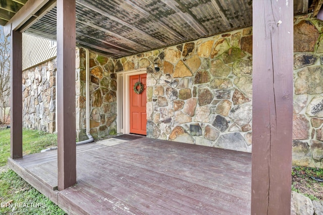 entrance to property with stone siding